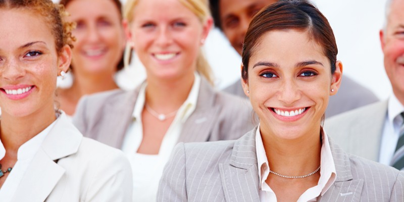 Portrait of happy business people against white